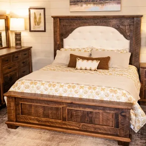 farmhouse style bed with fabric headboard