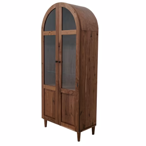 A wooden cabinet with two closed doors, black handles, and a curved top stands on four legs against a white background.