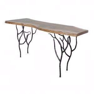 A wooden table with a natural edge and black metal tree branch legs stands against a white background, showcasing a rustic aesthetic.