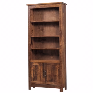 A wooden bookcase with three shelves and two doors stands against a white background, showcasing a rustic aesthetic.