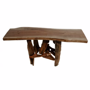 A rectangular wooden table, crafted from dark brown wood and featuring an uneven top edge, stands on four sturdy tree trunk legs.