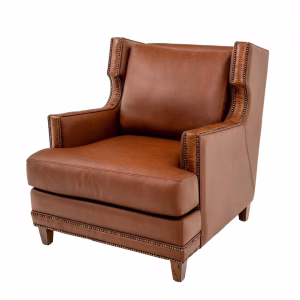A brown leather armchair with wooden legs, beaded detailing, and curved backrest and armrests is positioned at a slight angle, facing right.