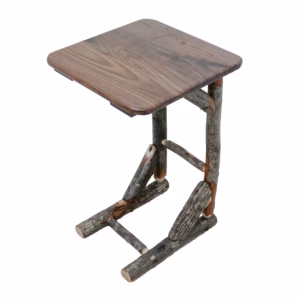A rustic wooden side table with a natural finish and curved top holds a few objects, displaying a charming, casual aesthetic.