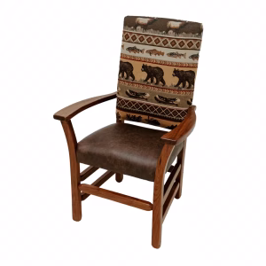 A wooden chair with a woven seat displaying a nature pattern (bears, fish, mountains) sits against a white background.