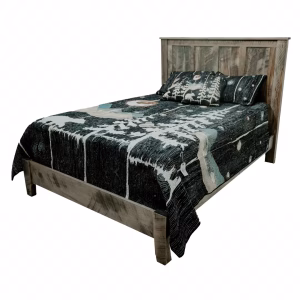 A wooden bed with a black and white quilt featuring a tree and bird design creates twoppery surfaces, inviting the use of a headboard and footboard.