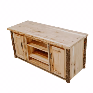 A wooden TV stand, crafted from light-colored wood and featuring two cabinet doors and a shelf, stands against a white background, showcasing its rustic charm.