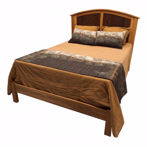 A wooden bed with a dark brown headboard and footboard, adorned with a brown comforter and deer headpat, sits against a white background.
