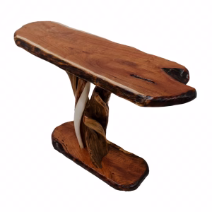 A wooden table with a natural, uneven edge and two twisted tree trunks as legs is supported by a central wooden plank.