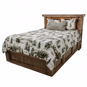 A wooden bed with a "forest" comforter and two pillows is framed by a headboard and footboard, standing against a white background.