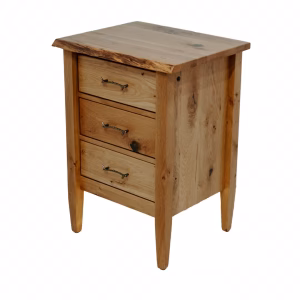 A light-colored wooden nightstand with three drawers and a flat top, featuring a simple and rustic design.