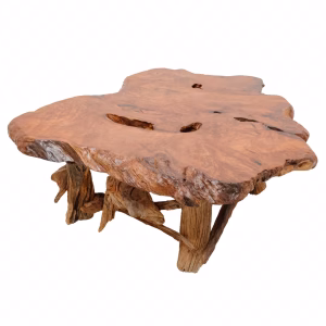 A wooden coffee table with a natural, rough-hewn edge and intricate branch designs sits on a white surface, empty and alone.
