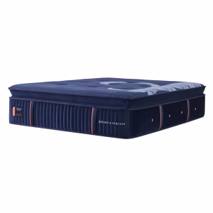 A navy blue Stearns & Foster mattress with orange stripes and a blue and white geometric pattern rests on a white background.