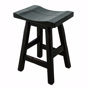A black wooden stool with a curved seat and sturdy legs is captured from a three-quarter angle, highlighting its rustic charm.