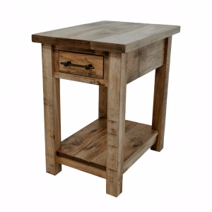 A light-colored wooden end table with a drawer and shelf stands against a white background, showcasing a simple and uncluttered design.