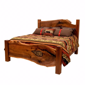 A wooden bed with a natural wave headboard and footboard features a colorful quilt and brown pillows with red accents, presented against a white background.