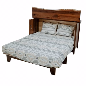 A wooden bed with a geometric patterned comforter and pillows, set against a white background, showcases a rustic charm.