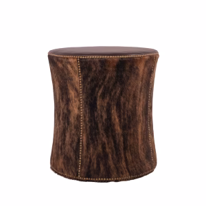 A cylindrical brown mottled-hide stool featuring brass nailhead trim around the top, bottom, and vertical seams.