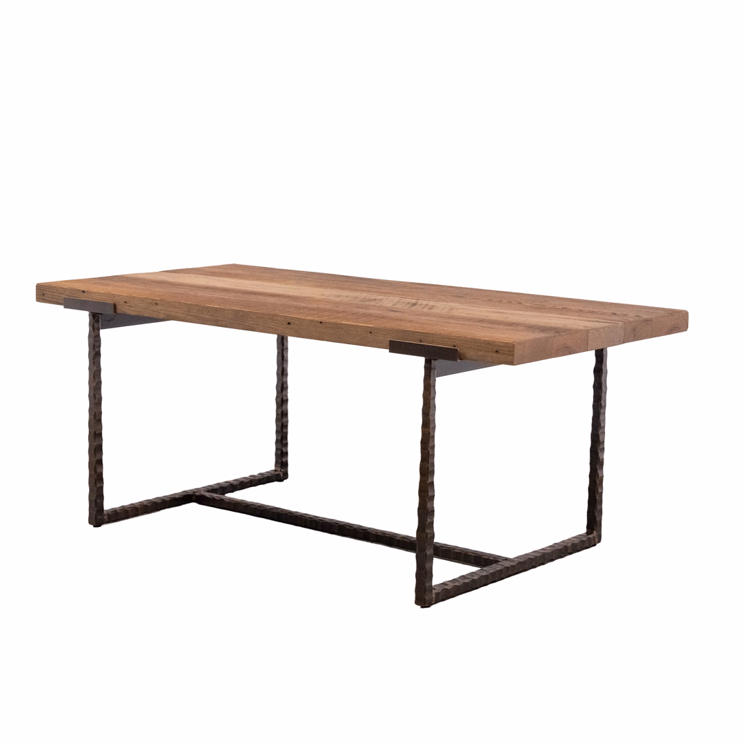 An industrial-style rectangular table featuring a thick, rustic wooden top and a dark metal frame base.