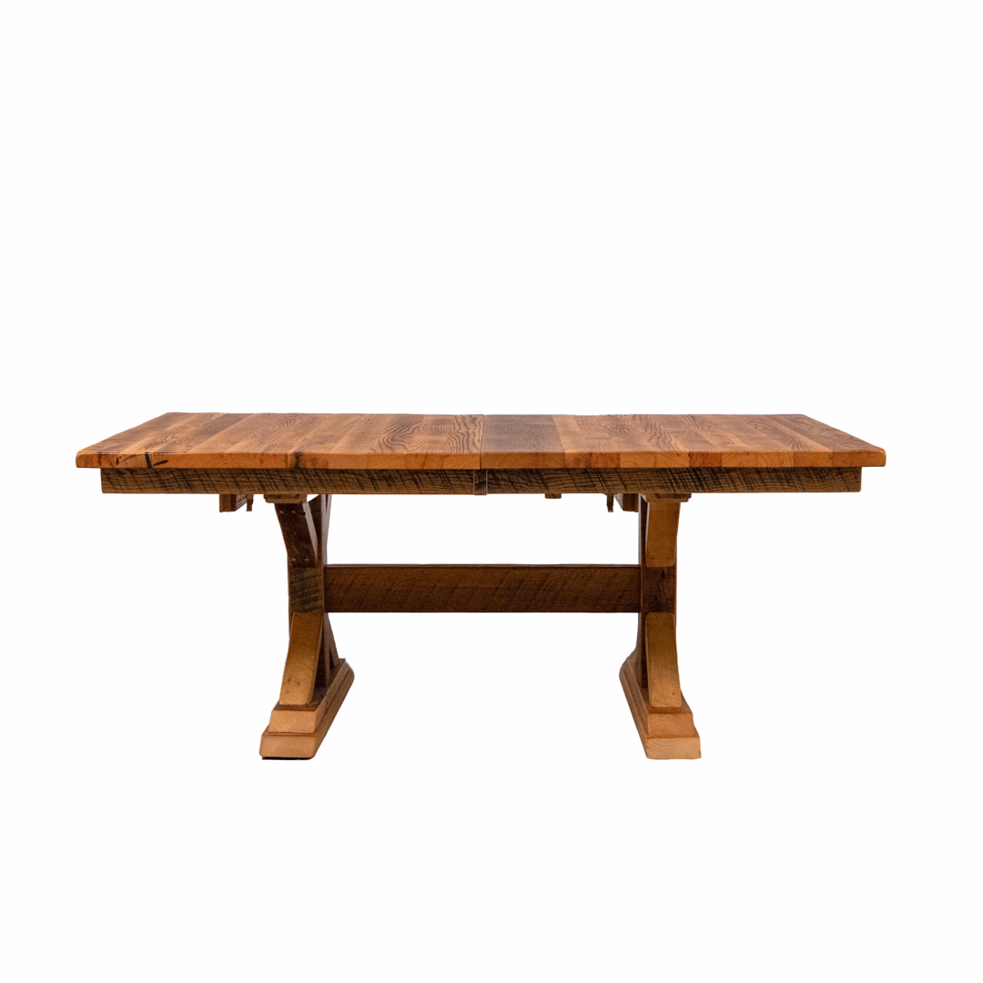 A rustic brown wooden trestle table against a plain white background.