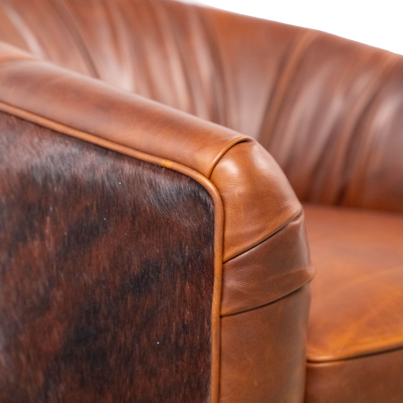 small leather swivel chair with cowhide