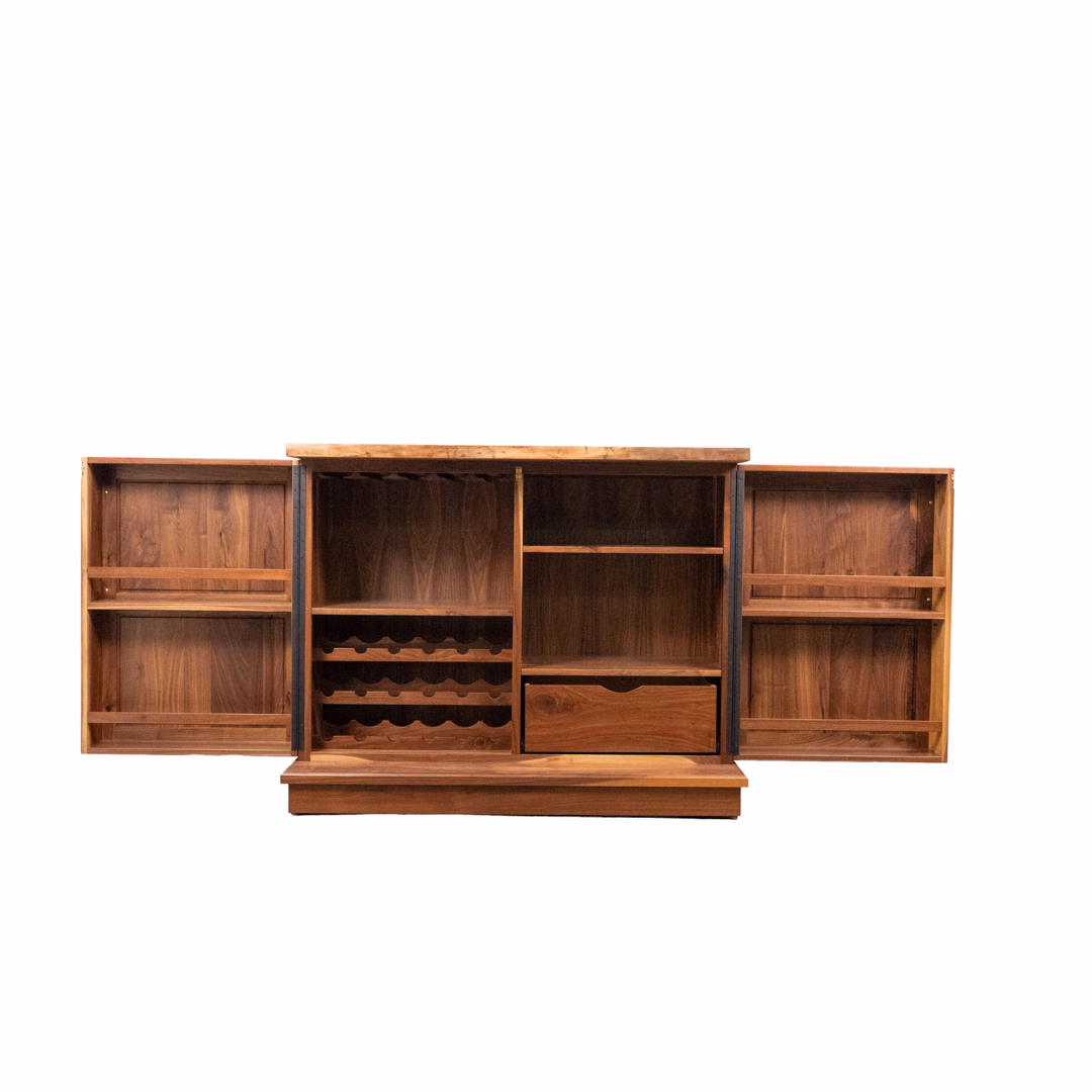 A large, multi-compartment wooden shelving unit featuring a built-in wine rack, a drawer, and symmetrical side shelves.